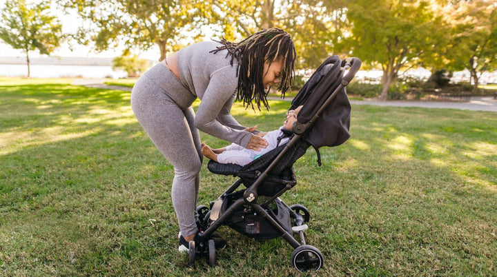 Mom reading book to baby