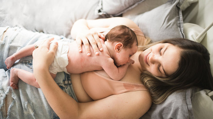 Mother giving skin to skin to newborn baby