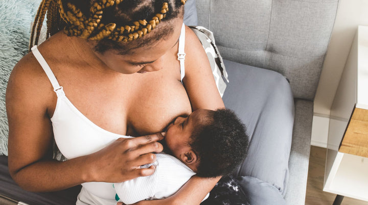 A baby feeding on the breast