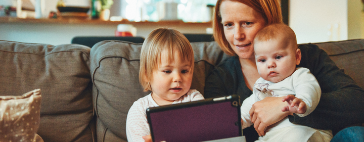 Mom with babies watching the ipad