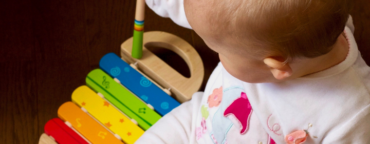 Baby playing with musical toy