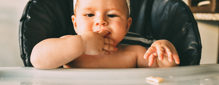 Baby eating finger foods