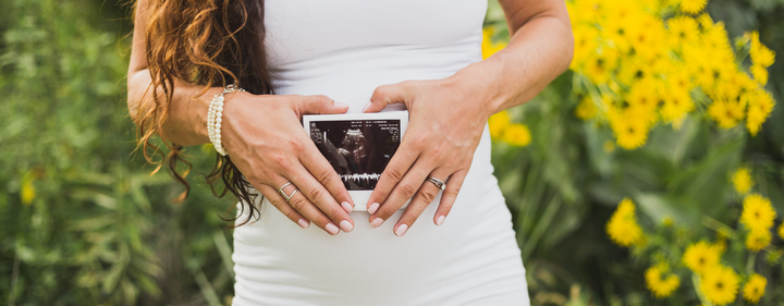 pregnant mom holding ultrasound