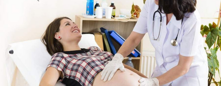 Pregnant woman at doctors office