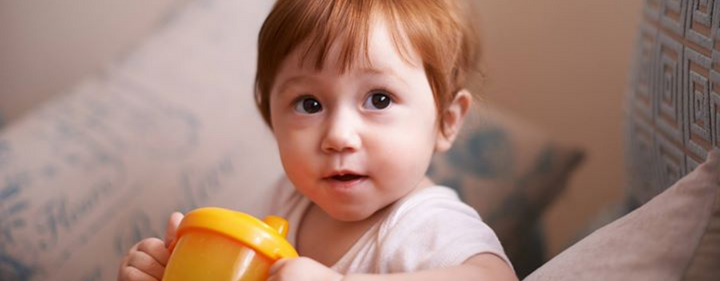 Baby with a sippy cup